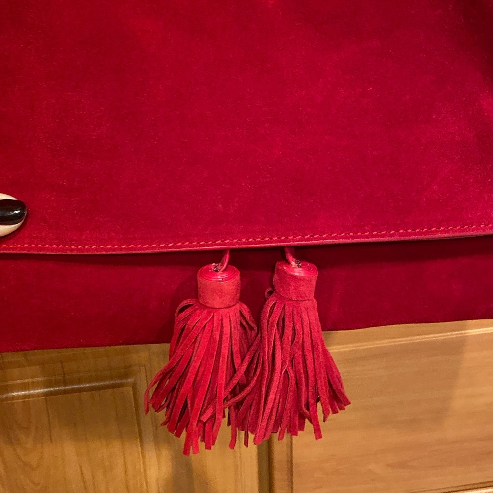 Tomato red suede clutch.